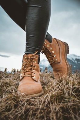man wearing boots standing on ground