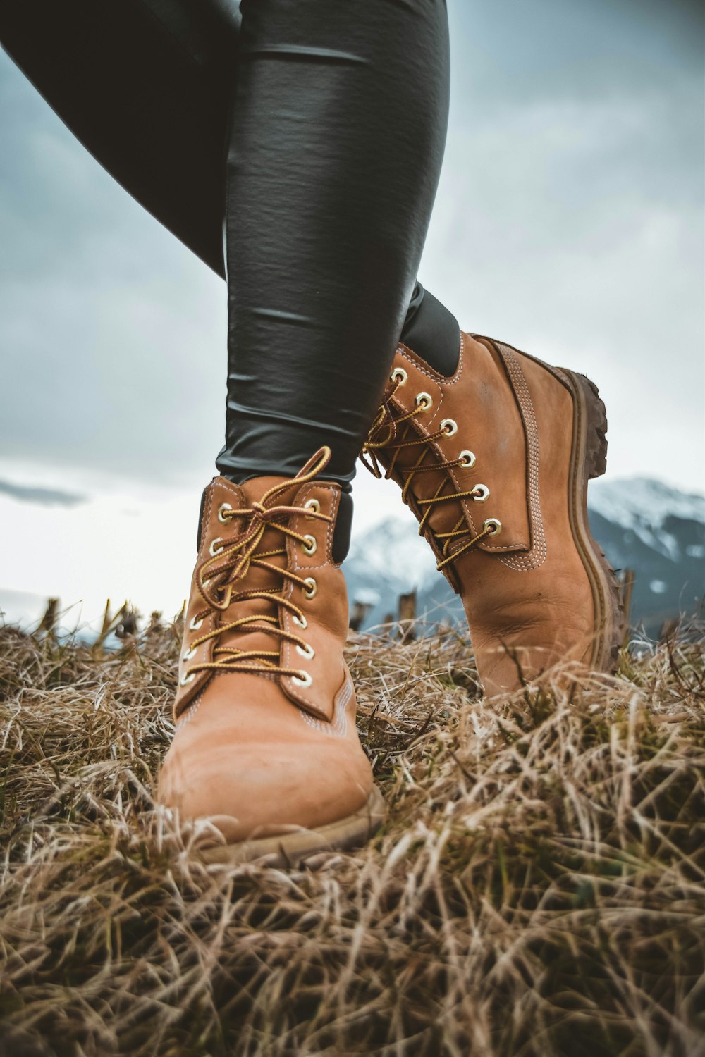 man wearing boots standing on ground