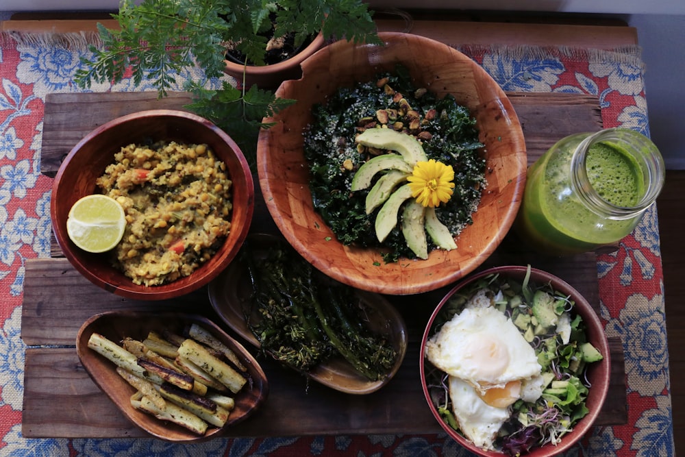 assorted foods on bowls