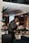man standing holding white teacup