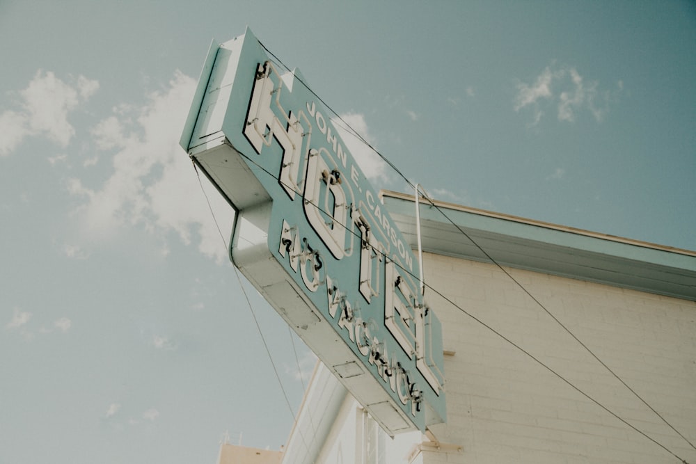 Hotel signage mounted on white building