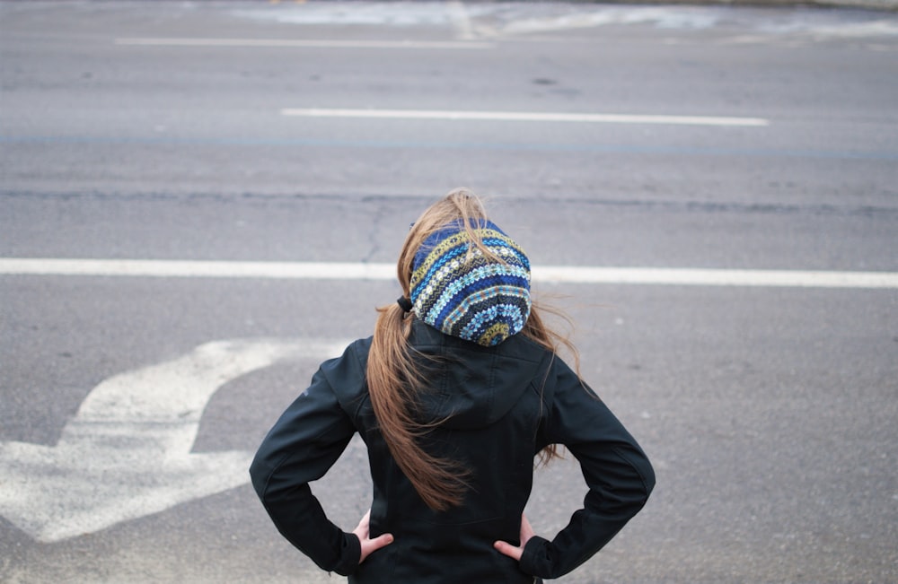 woman standing near road