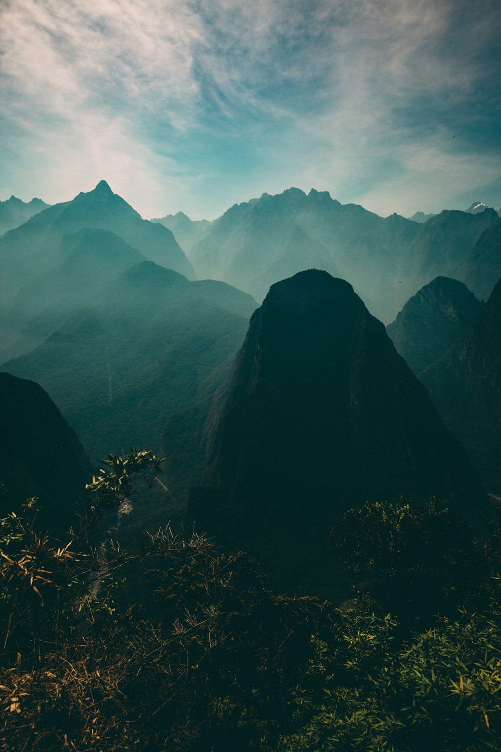 aerial photo of mountains and mist