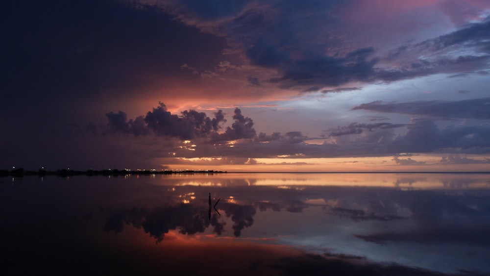 gray clouds with water reflection