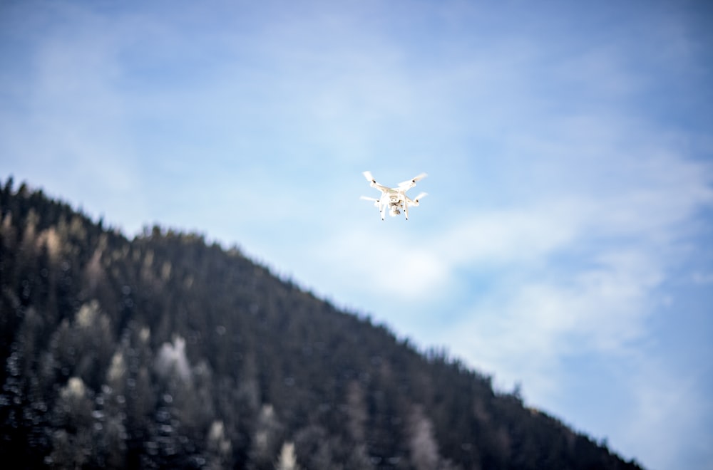 flying drone over forest trees