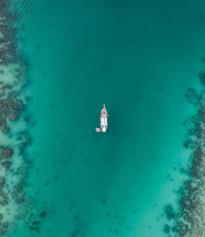 aerial view of boat on body of water at daytime