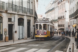 cable train in between high-rise building at daytime