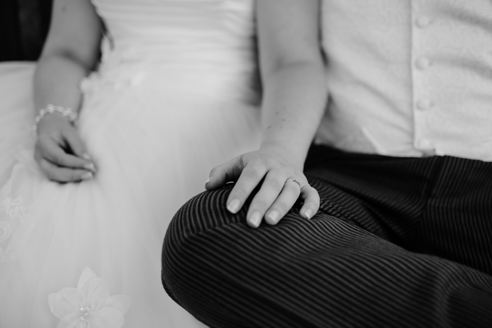 grayscale photo of two person sitting