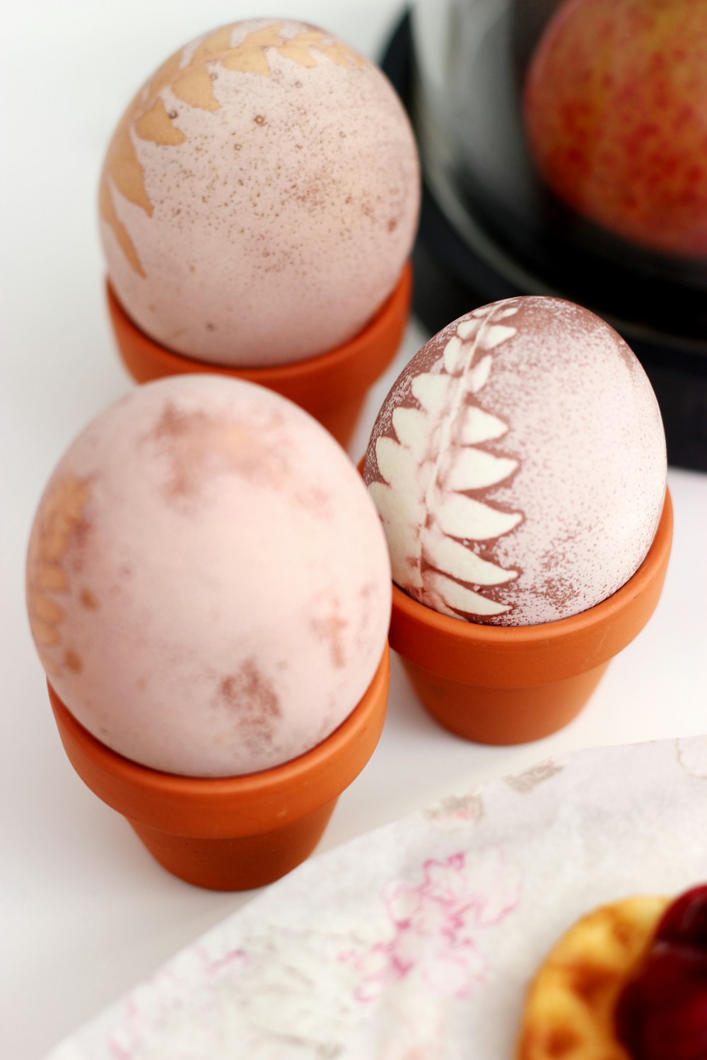 three white eggs on top of white surface