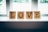 Wooden tiles with black letters spell out the word 'LOVE' while sitting on a windowsill. Each tile bears a small number in the corner, similar to Scrabble tiles. Soft natural light filters through the window, creating a cozy and serene atmosphere.
