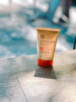 Natural Sun cream bottle on table