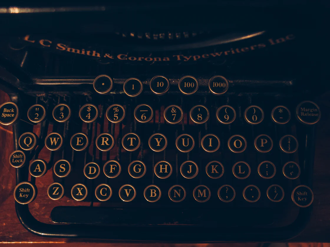 Round keys on a dark vintage typewriter