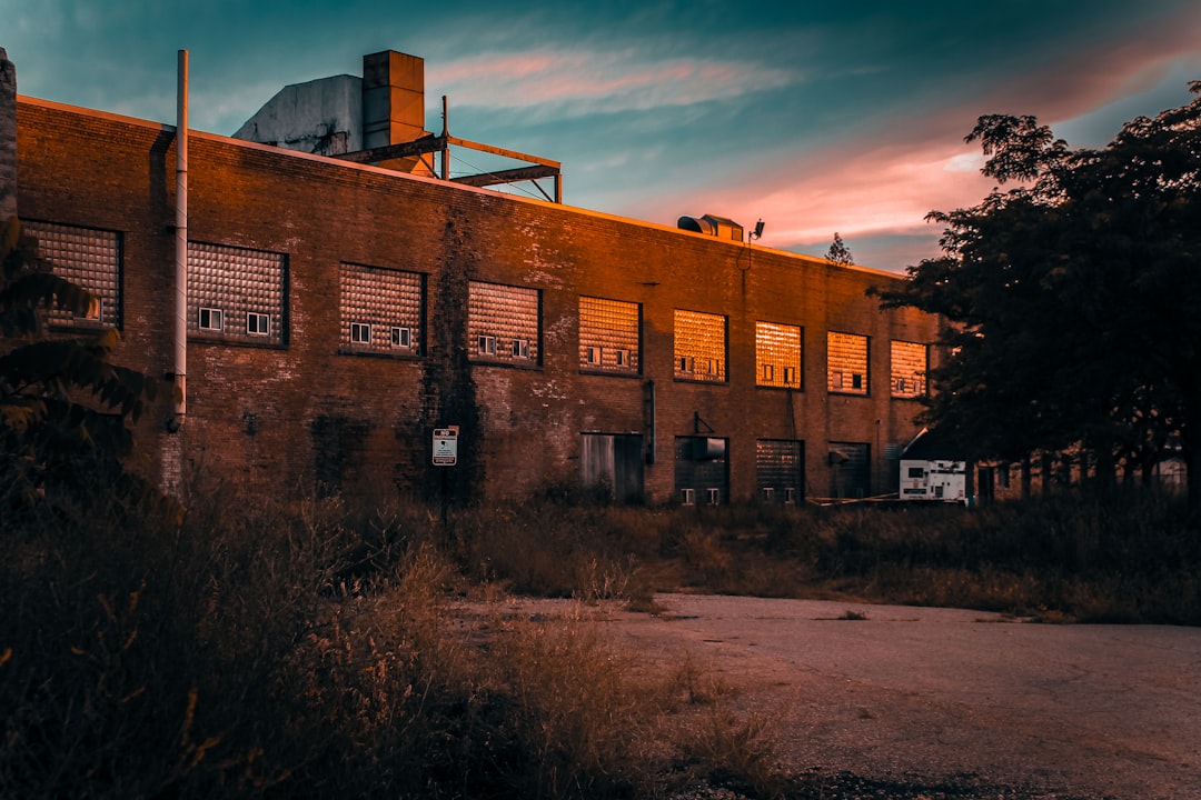 architectural photography of brown brick industrial building