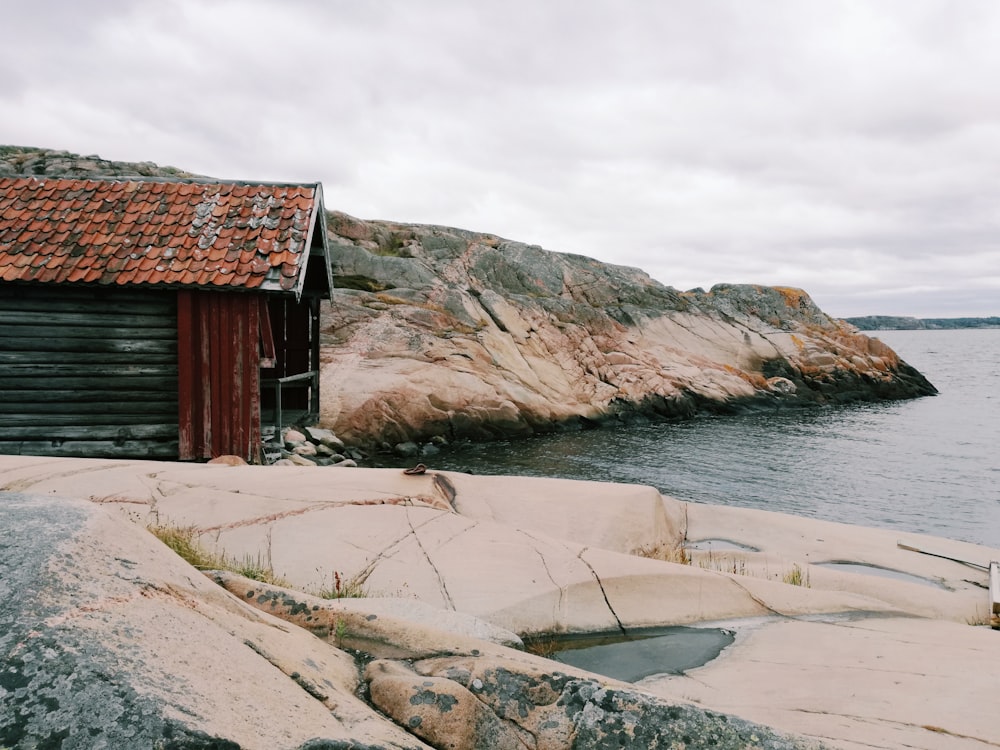 brown house beside a body of water