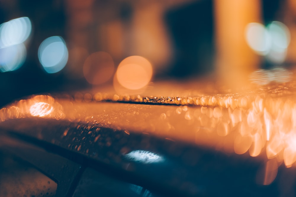 dew on roof of car bokeh photography