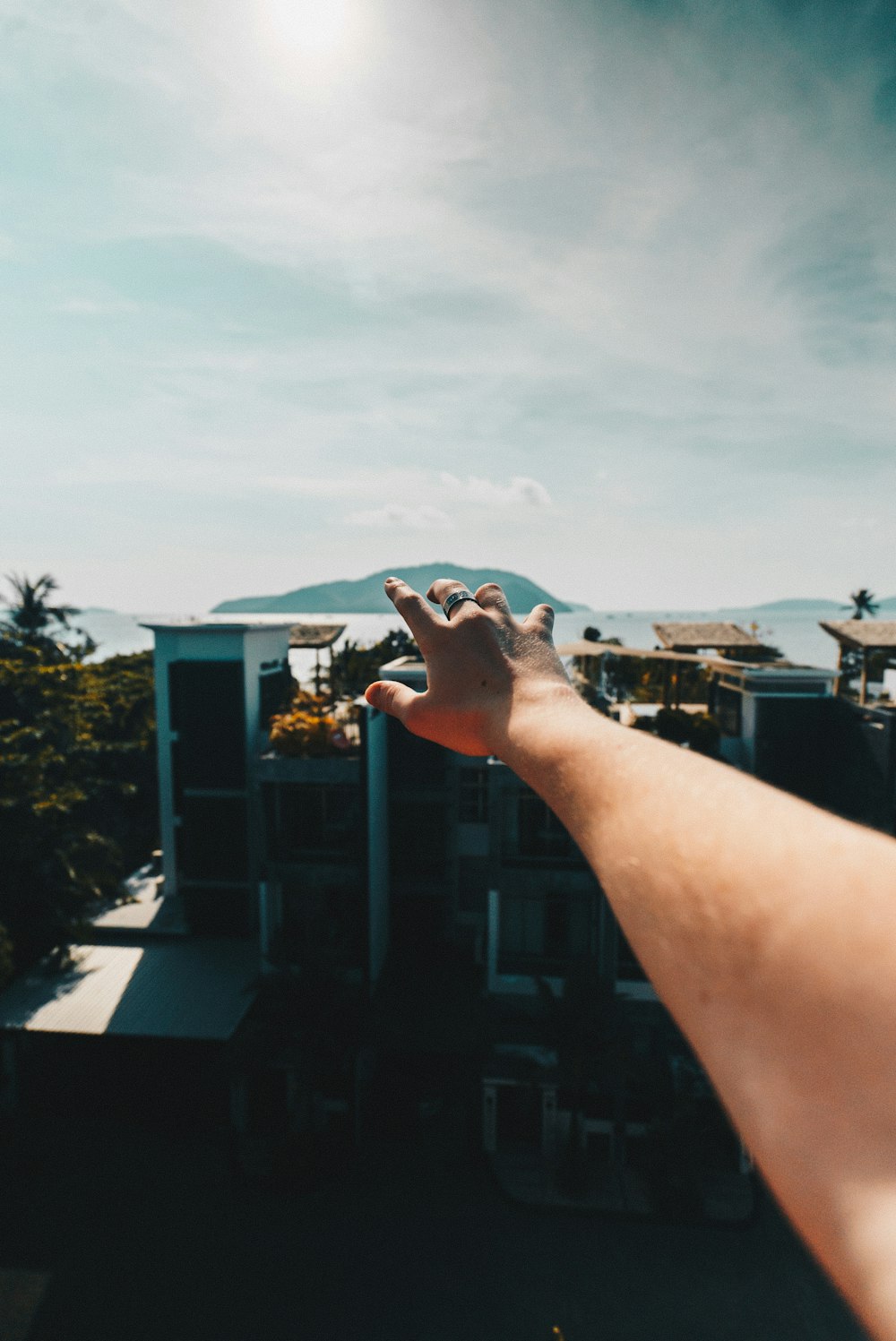 selective focus of person raising hand during daytime
