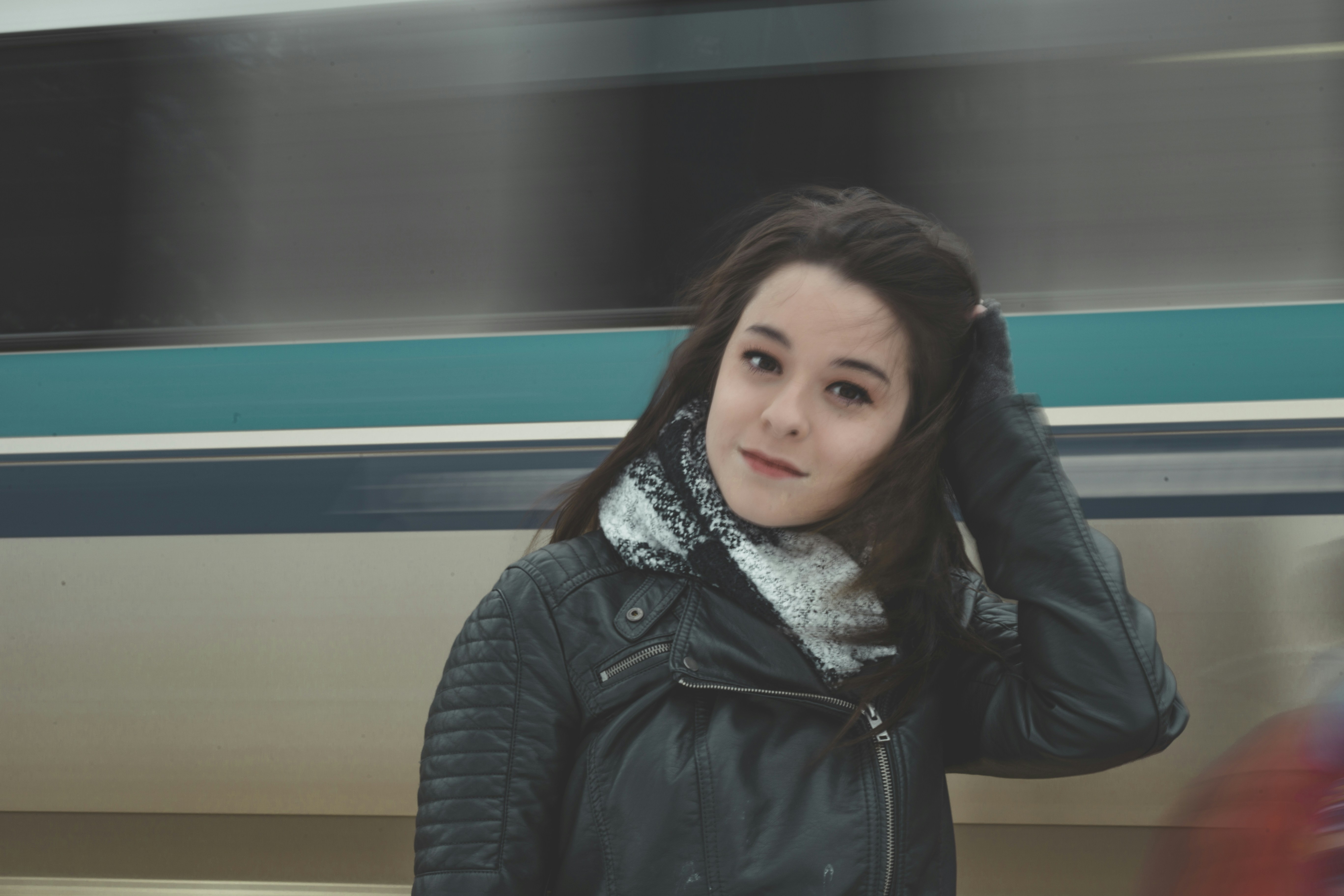 shallow focus photo of woman in black leather biker jacket