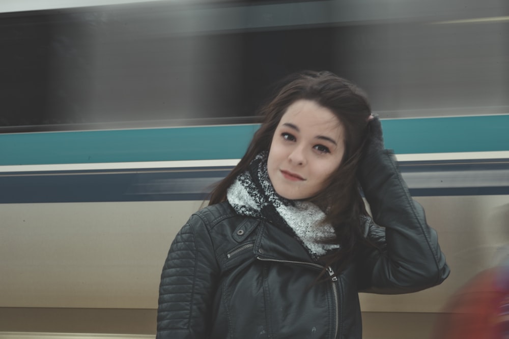 shallow focus photo of woman in black leather biker jacket