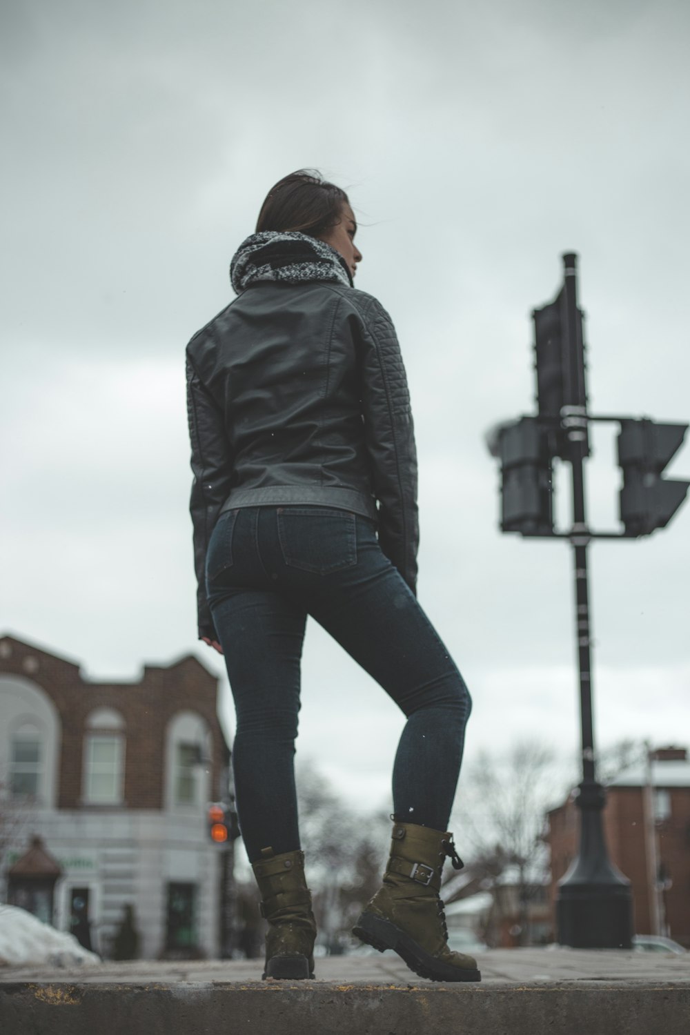 selective focus photo of woman standing on roadway