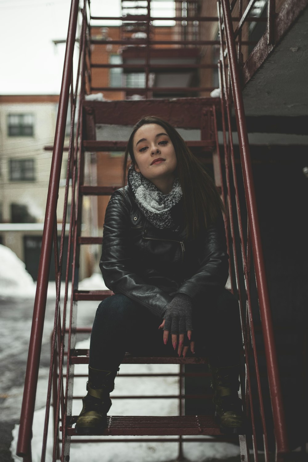 woman sitting on stair