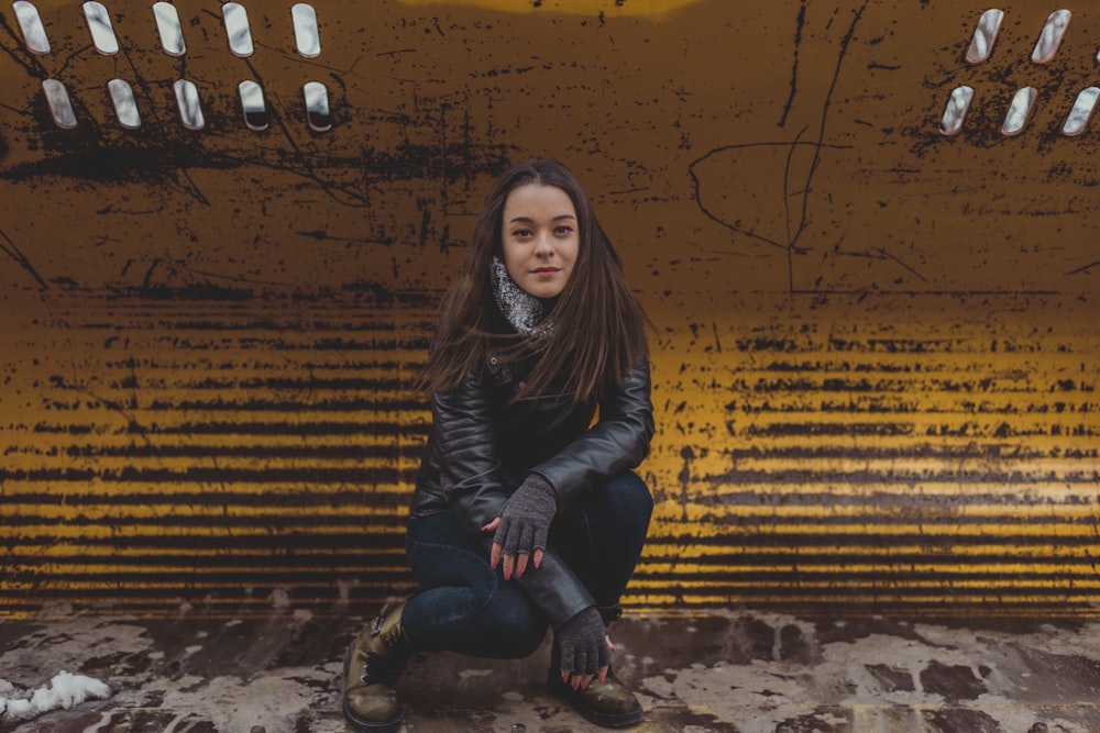 woman wearing black leather jacket