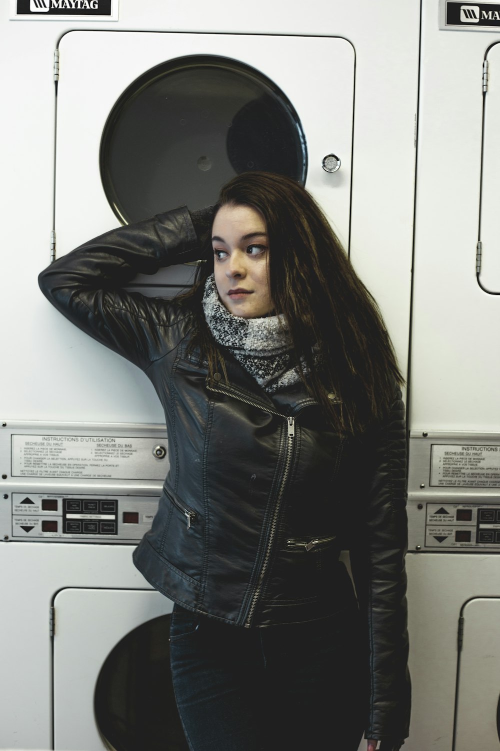 woman leaning against washing machine