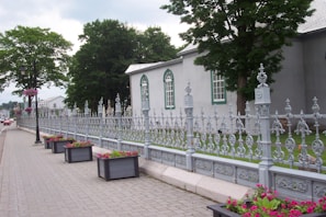 A sturdy fence freshly painted in slate grey, showcasing our attention to detail in property preservation.