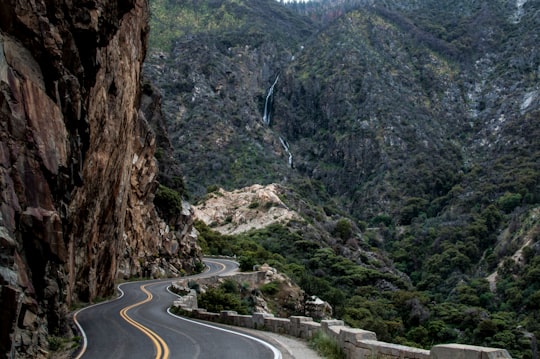 asphalt road beside cliff in Kings Canyon National Park United States