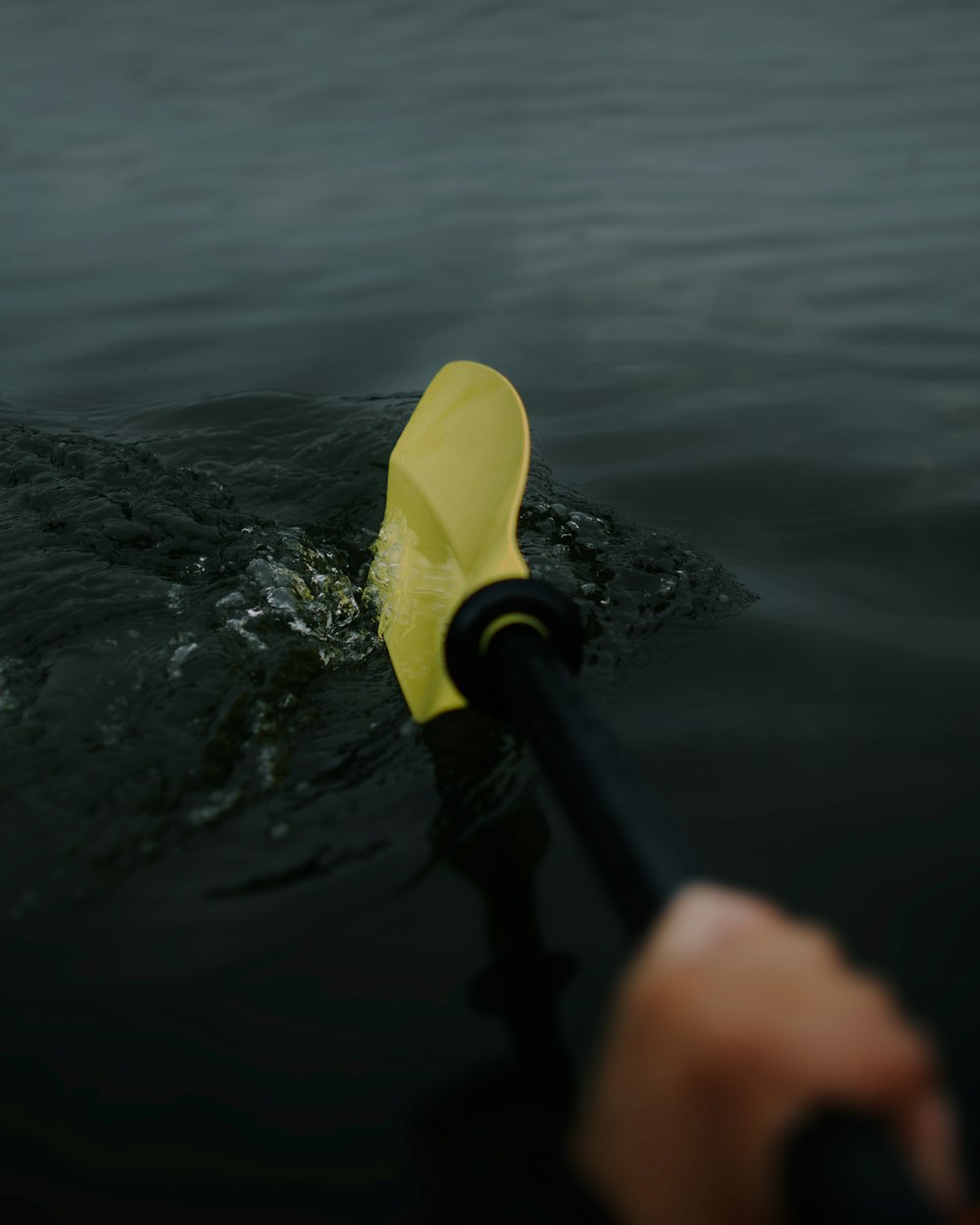 person paddling in water
