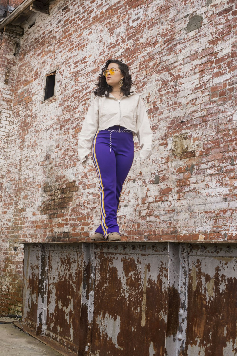 woman standing on brown steel bar