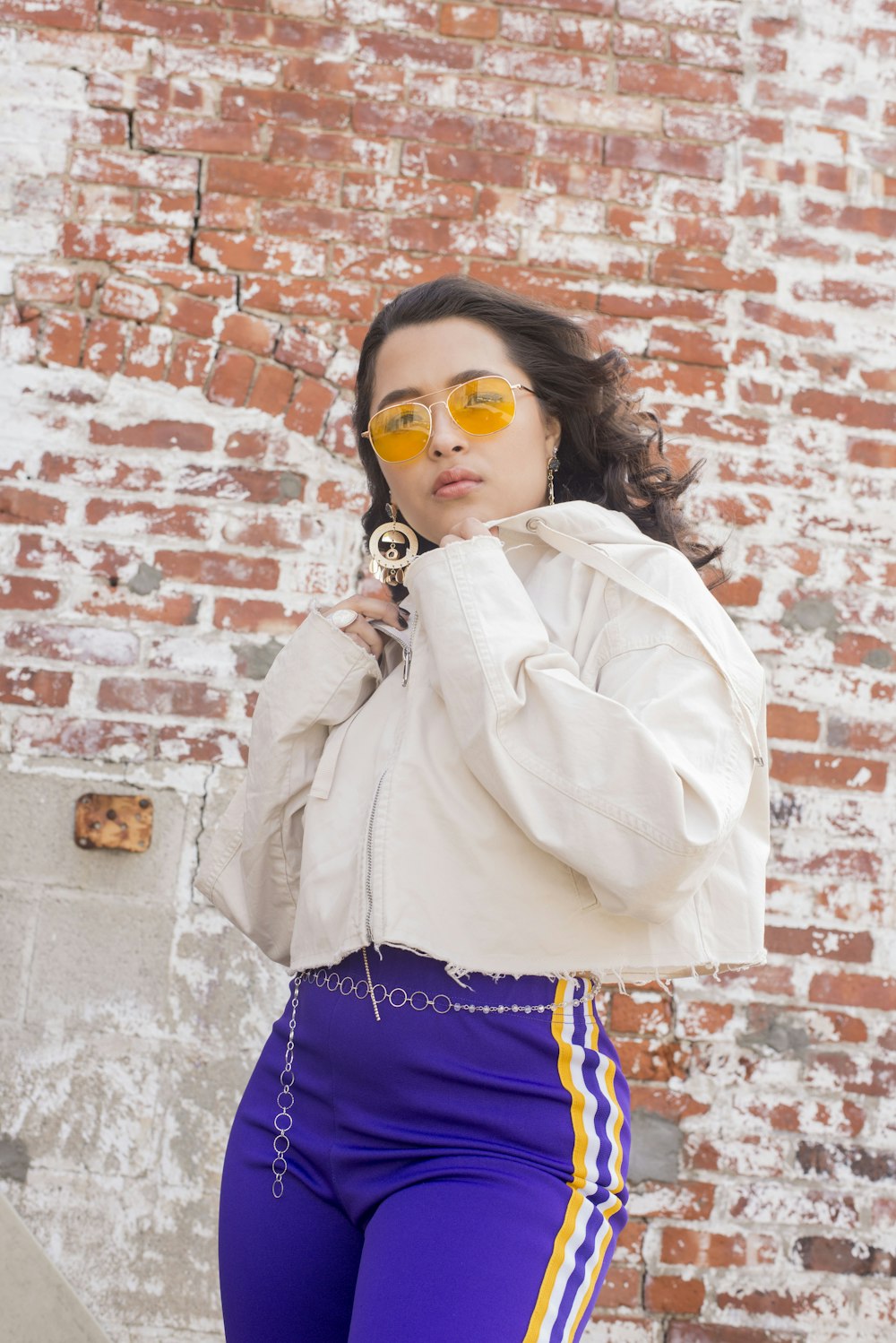 woman in beige top looking at the camera