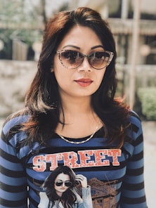 Portrait of a woman with trendy sunglasses, a member of the eyecoqatar.com team