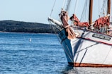 white and red boat on water during daytime