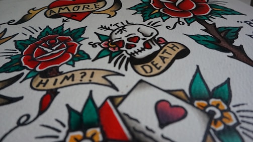 white, green, and red skull and flower print textile