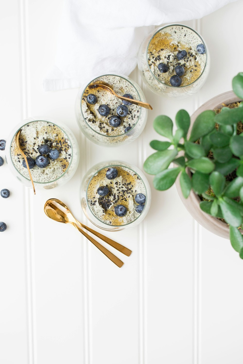 brass-colored spoon near glass of ice cream