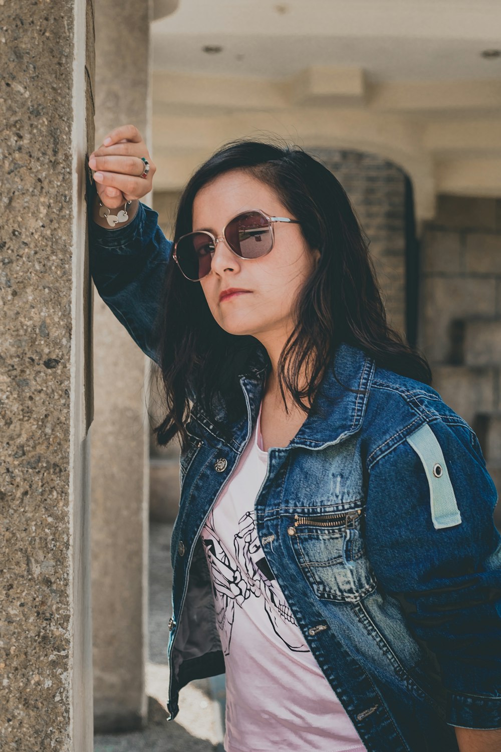 woman posing leaning on wall