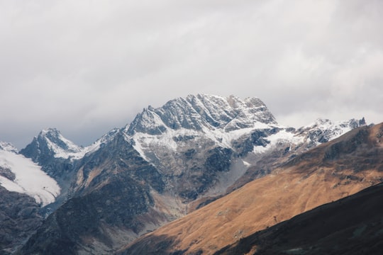 white and brown mountains under cloudy sky at daytime in Mount Elbrus Russia