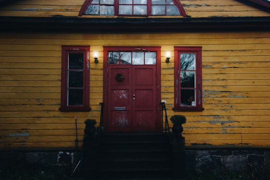 photo of brown painted house in Suomenlinna Finland