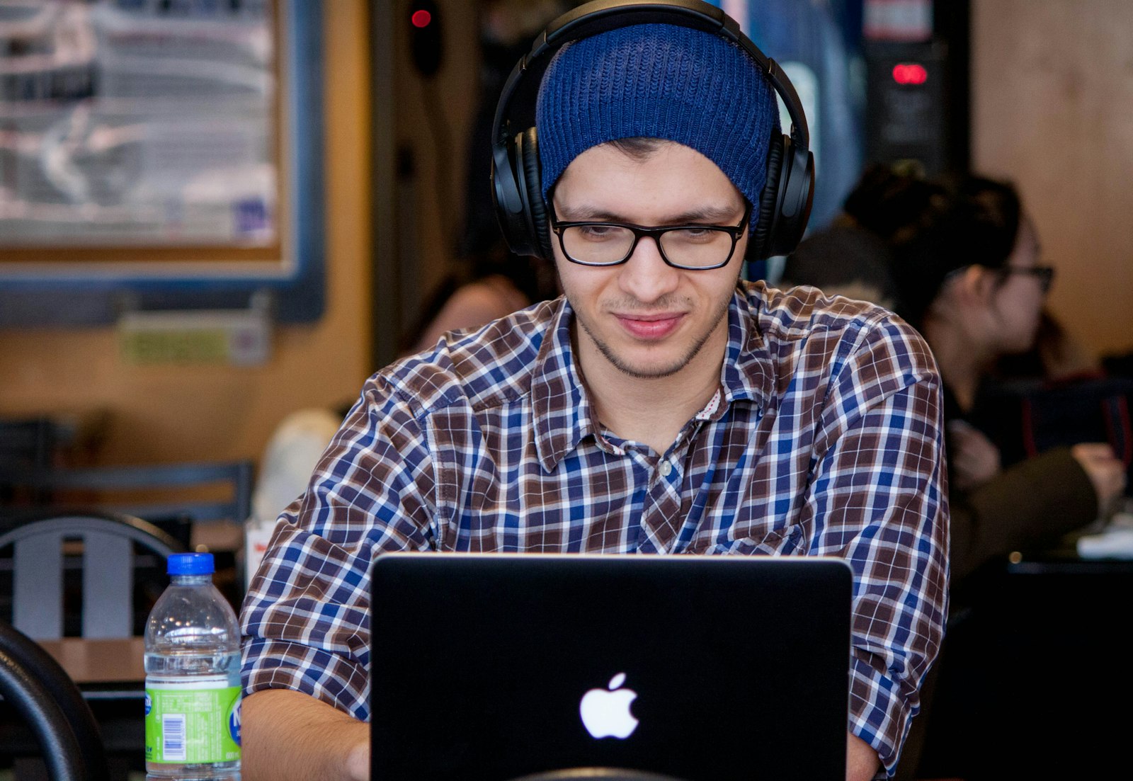 Canon EOS 50D + Canon EF-S 55-250mm F4-5.6 IS II sample photo. Man using macbook during photography