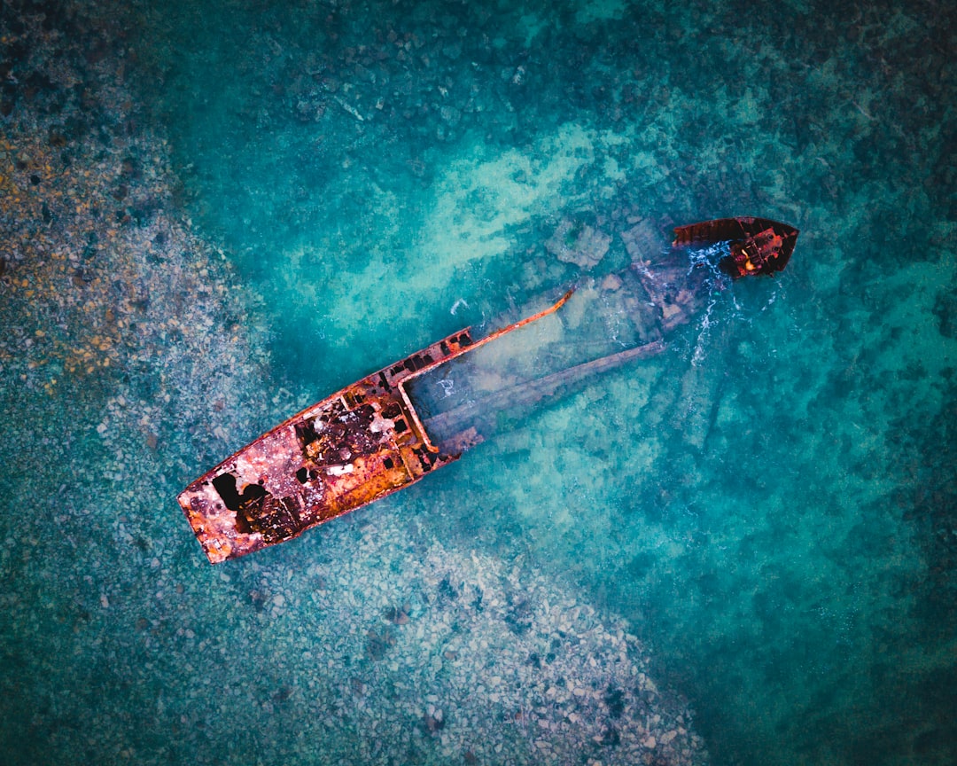 aerial view of brown ship on body of water