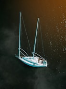 white boat on water at daytime