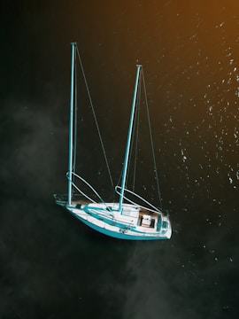 white boat on water at daytime