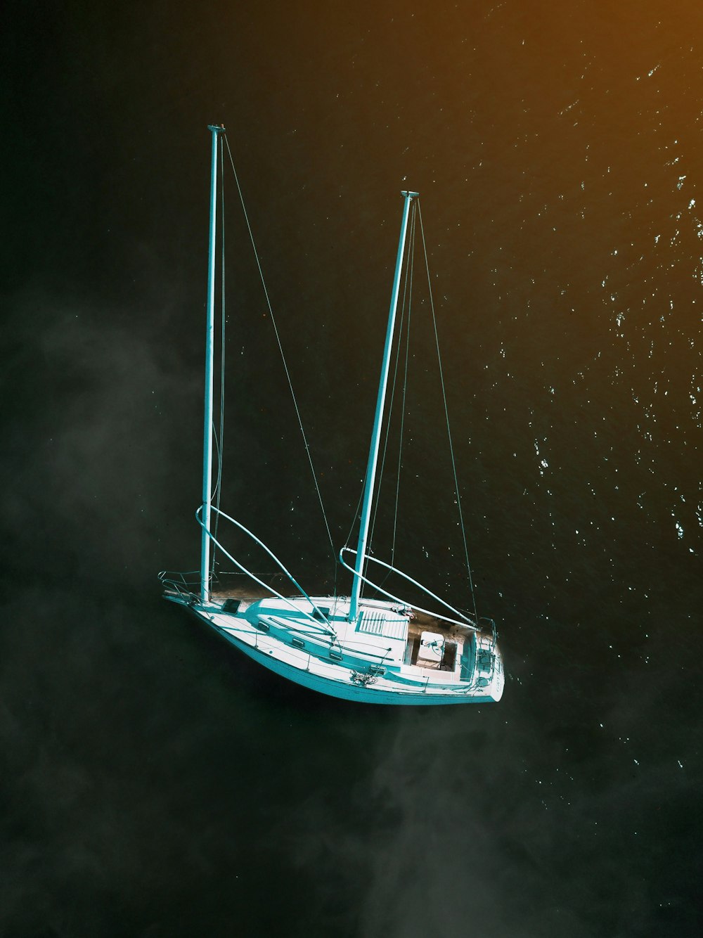 white boat on water at daytime