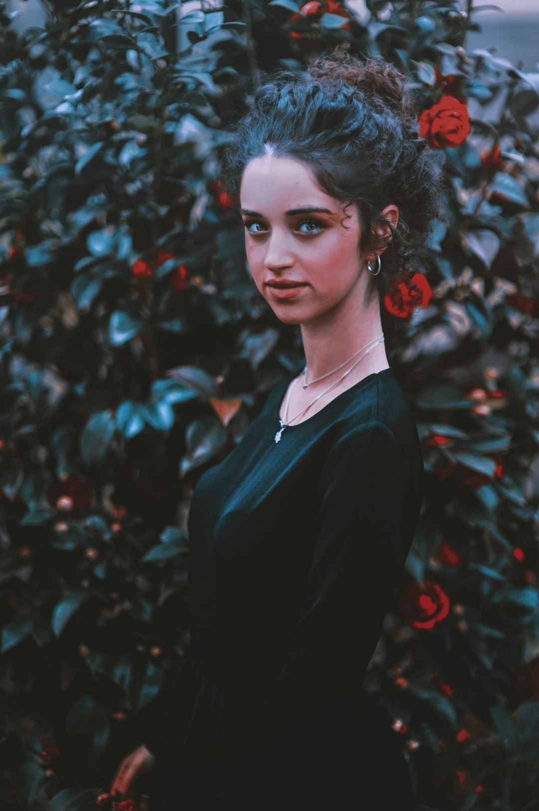 woman wearing black scoop-neck dress