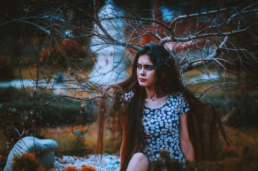 woman sitting near tree