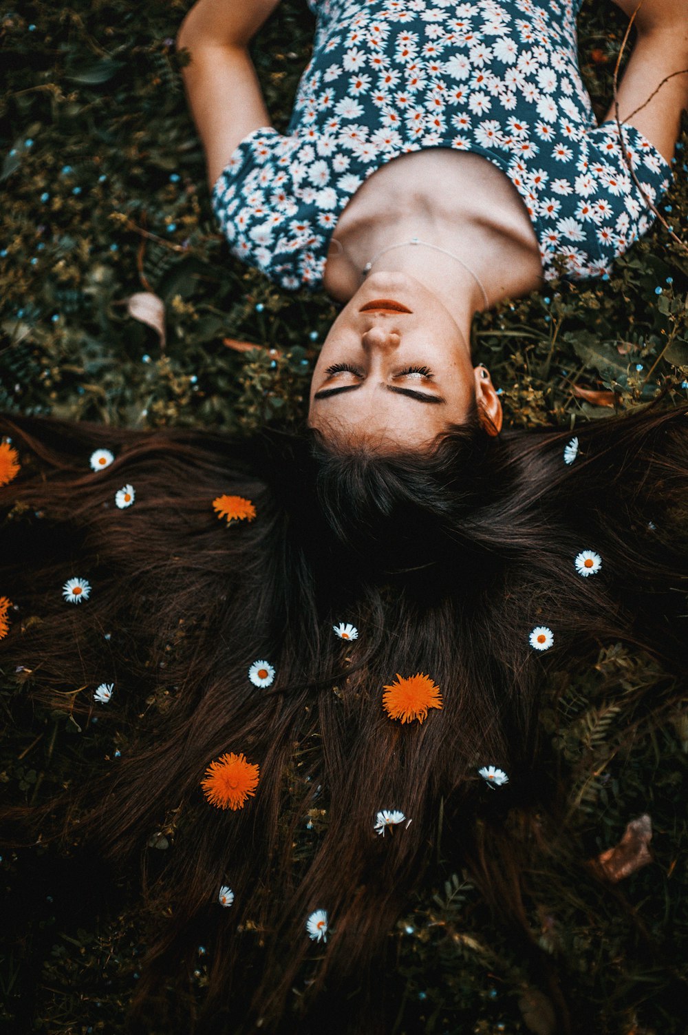 woman with hair covered in flower