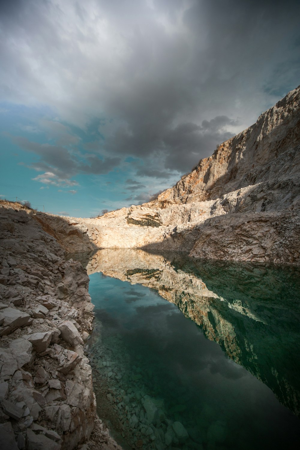 body of water between rock mountains