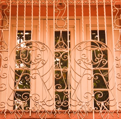 A friendly technician installing an invisible grill on a Royapettah balcony.