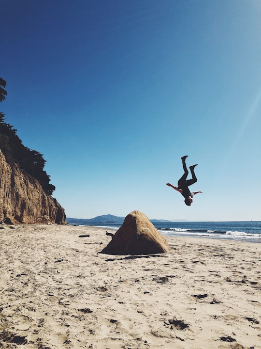 man back lifting on shore at daytime in Santa Barbara United States