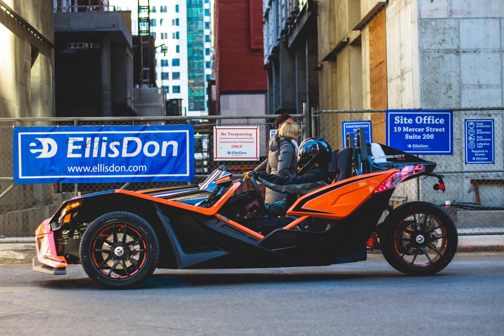 person riding 3-wheeled vehicle